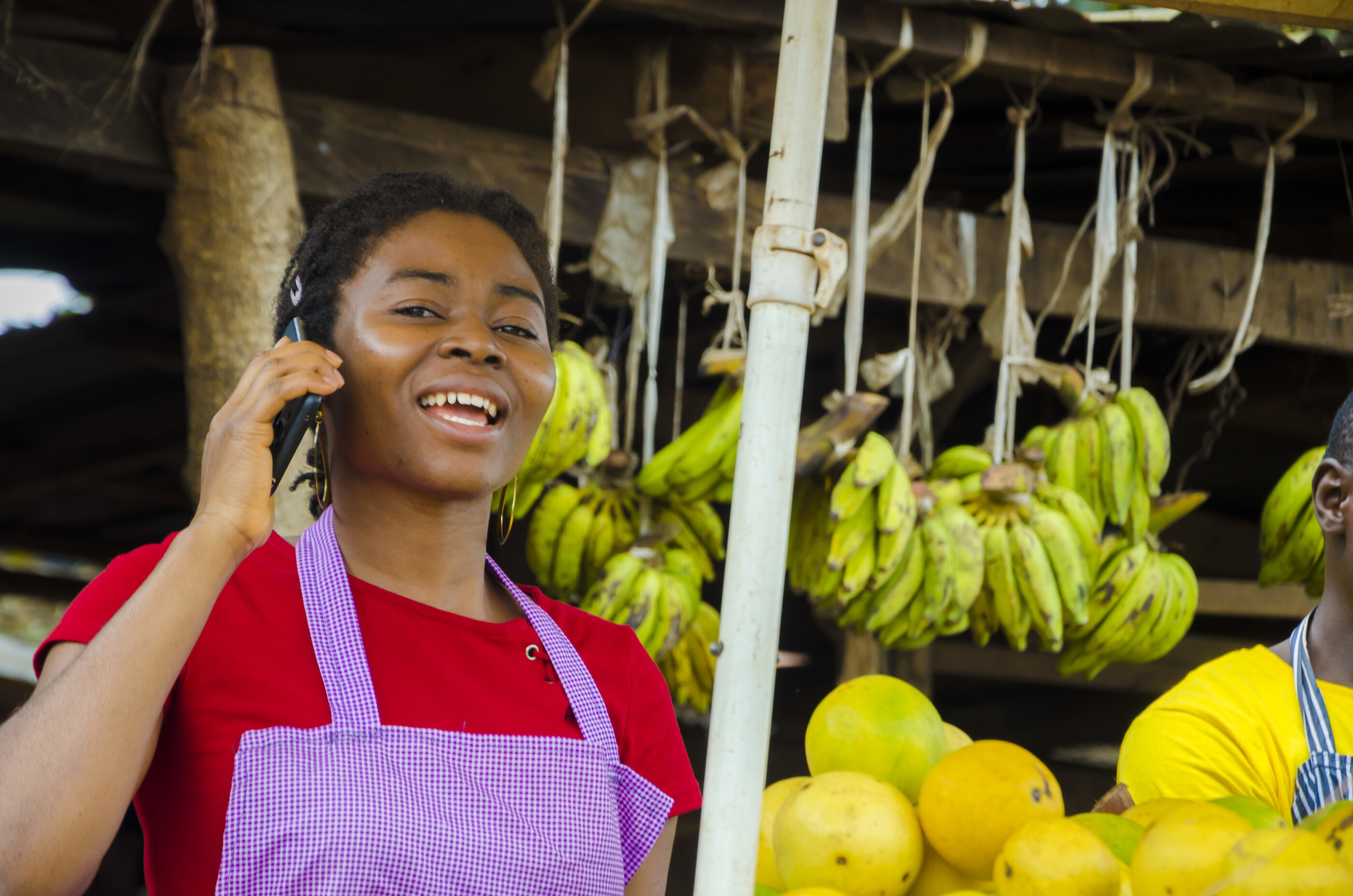 market seller on her cellphone